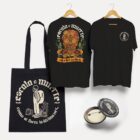 Kit con playera negra Escala a Muerte, tote del esqueleto y pin de colección.
